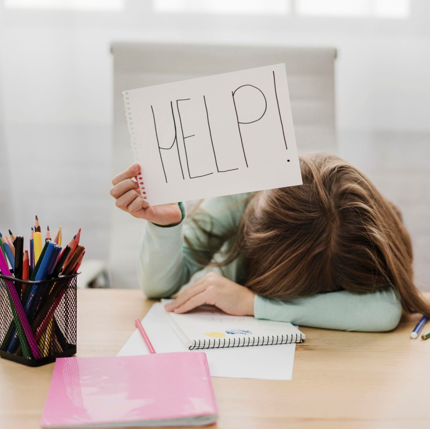 1little-girl-holding-help-message-white-paper
